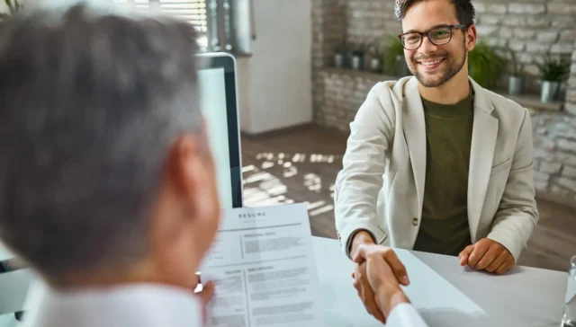 male candidate greeting a member of human resource team on a job interview